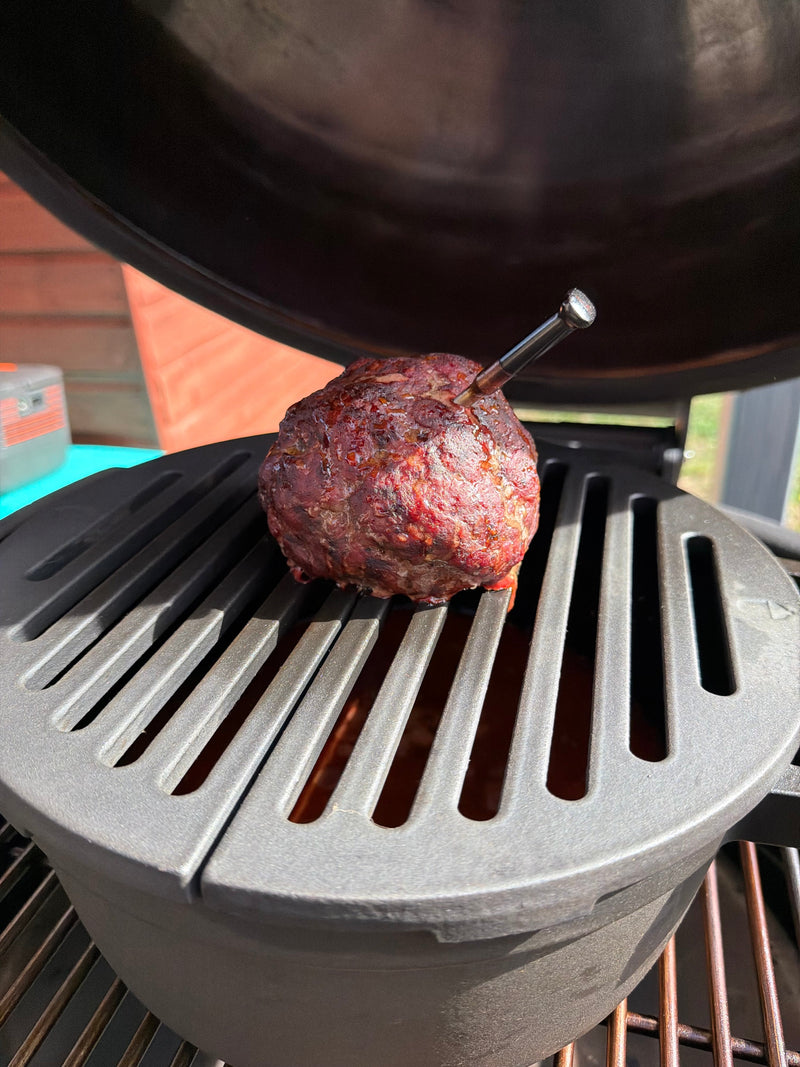 Minced meat smoking on a raised grate above a SmokePot for over-the-top chilli.