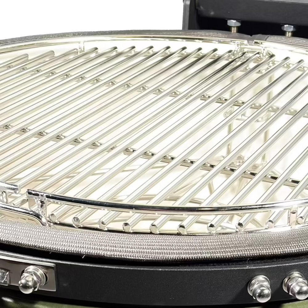 Close-up of stainless steel cooking grates inside an open kamado.