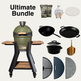 V2 Mini Ultimate Bundle with olive-green grill and stand, cookware, cover, charcoal and cooking surfaces.
